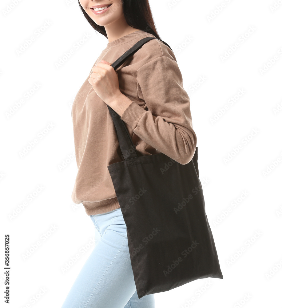 Young woman with eco bag on white background