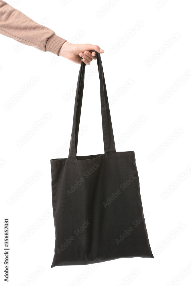 Female hand with eco bag on white background