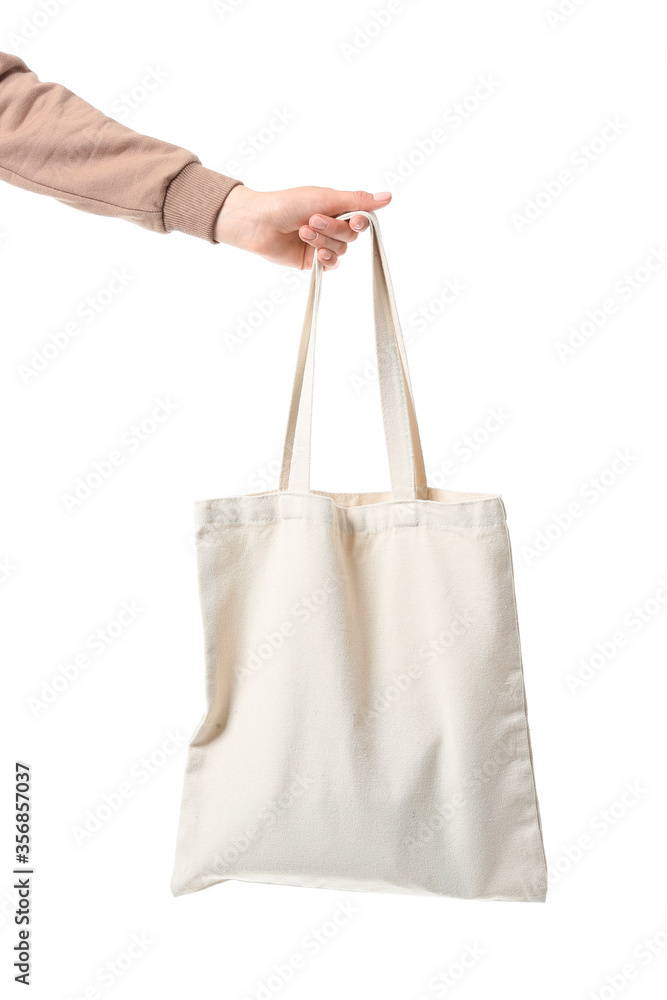 Female hand with eco bag on white background