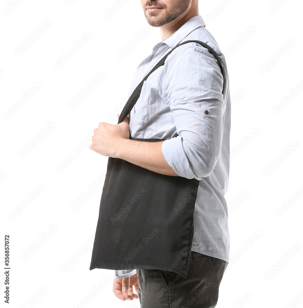 Young man with eco bag on white background