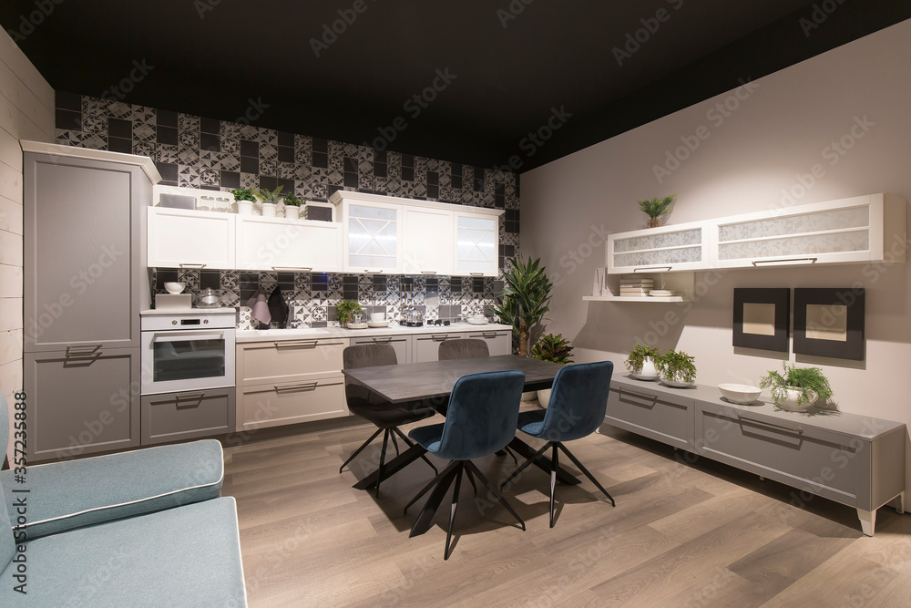 Real estate style photo of a home interior, tanek inside a modern kitchen. No people are visible.