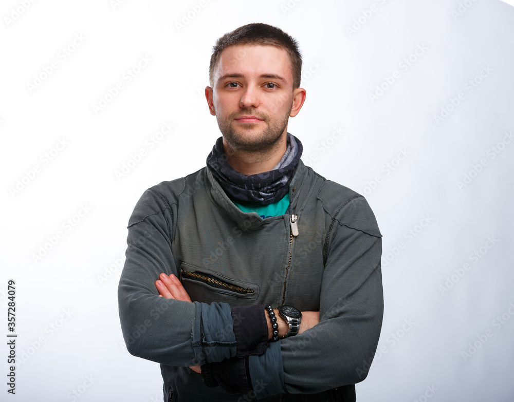 Hairdresser man with stands crosshands. People`s profession concept. Stylish man on white background