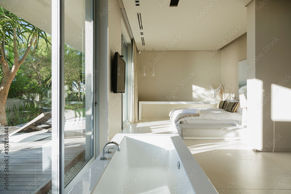 Bathtub in modern master bedroom