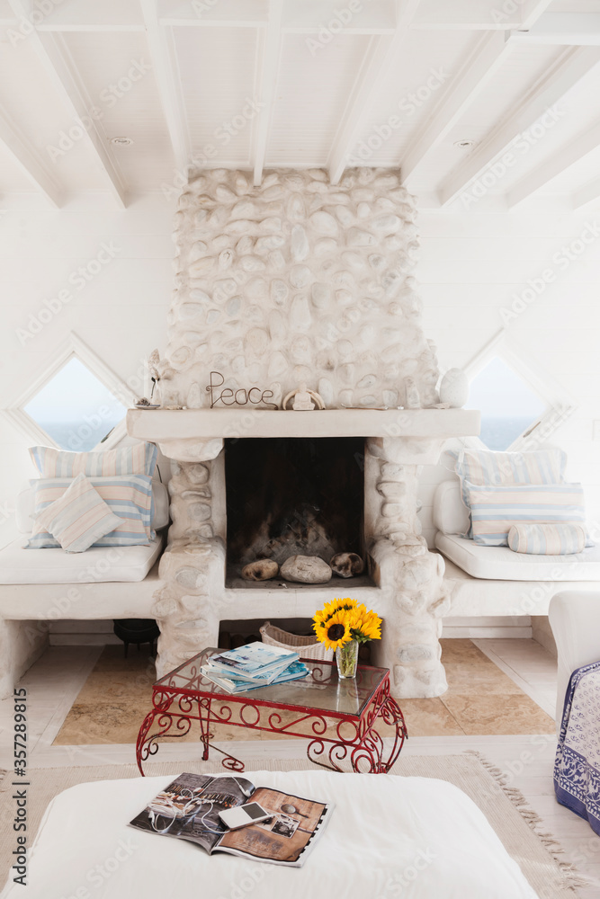 Coffee table and fireplace in white living room