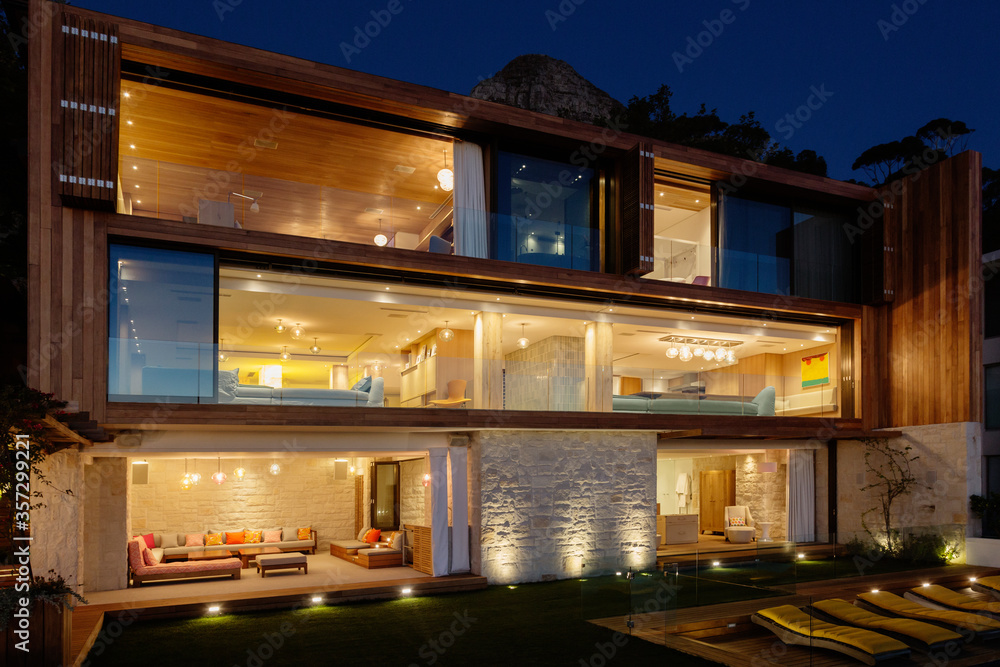 Modern house illuminated at night