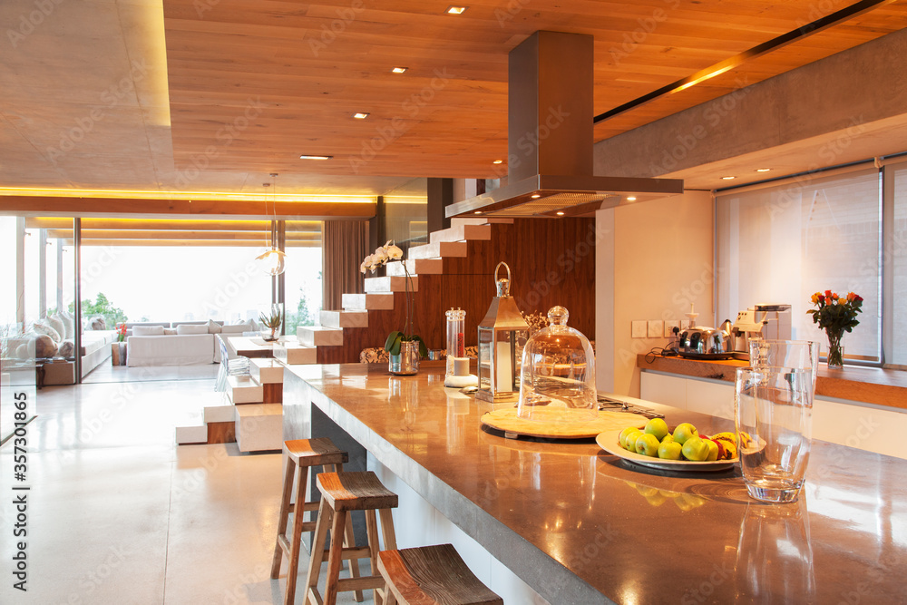 Counter, steps and sofa in open modern house