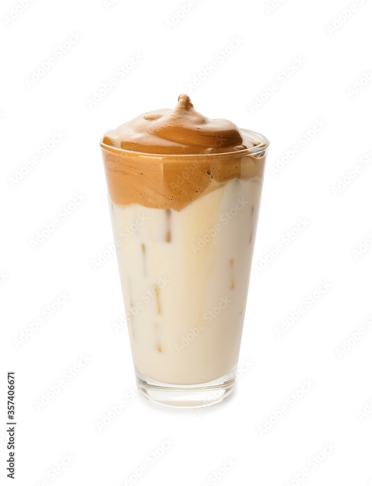 Glass of tasty dalgona coffee on white background