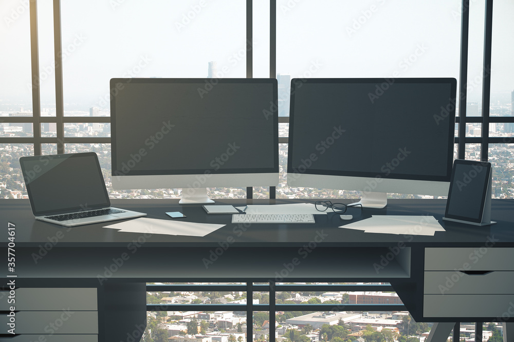 Clean designer desktop with two computer screen