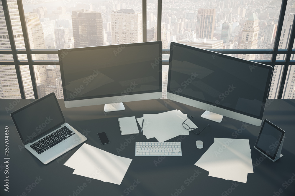 Top view of modern workplace with two empty black monitor