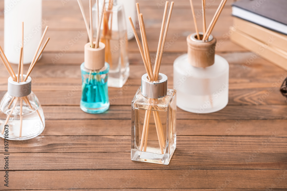 Reed diffusers on table in room