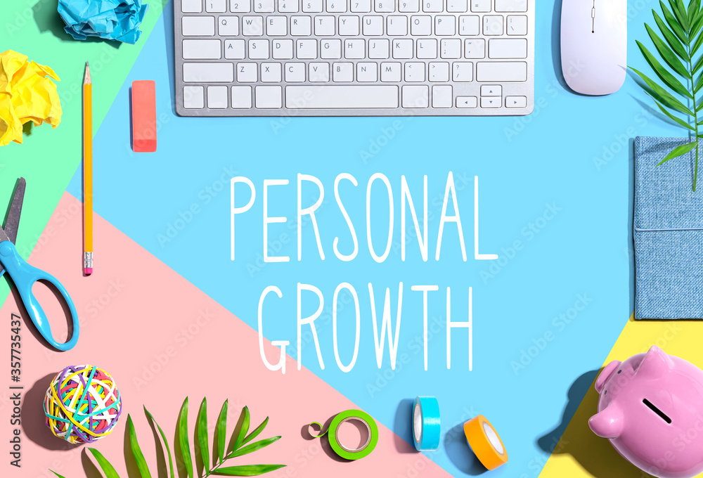 Personal growth theme with office supplies and a computer keyboard