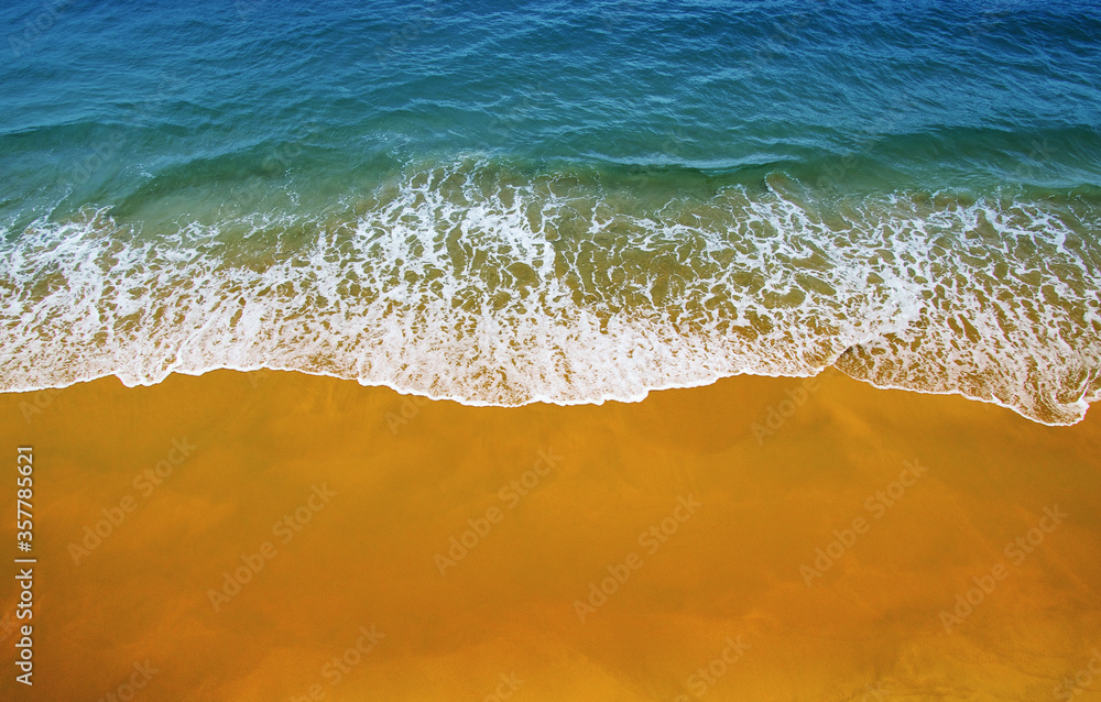 Wave of blue ocean on  beach.