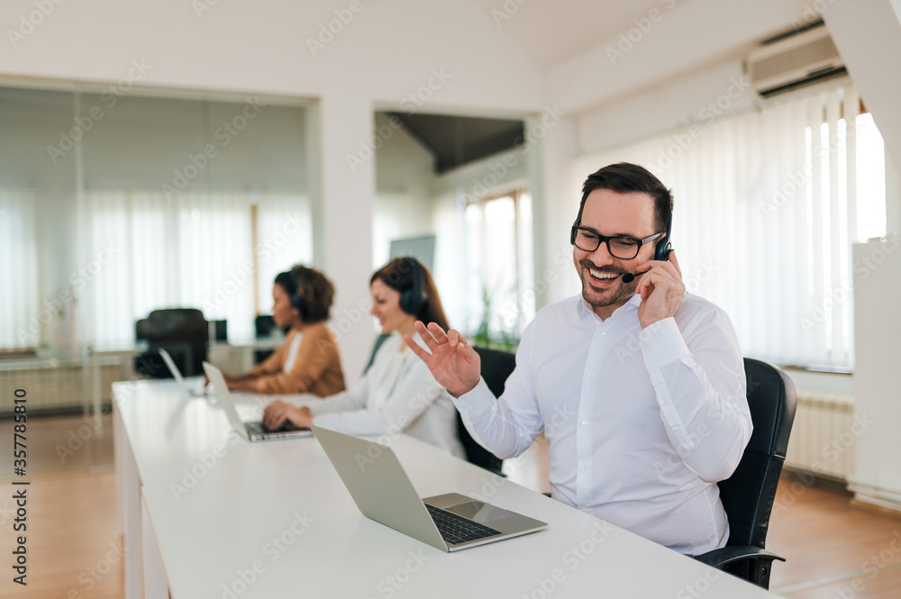 Positive sales agent at work, portrait.