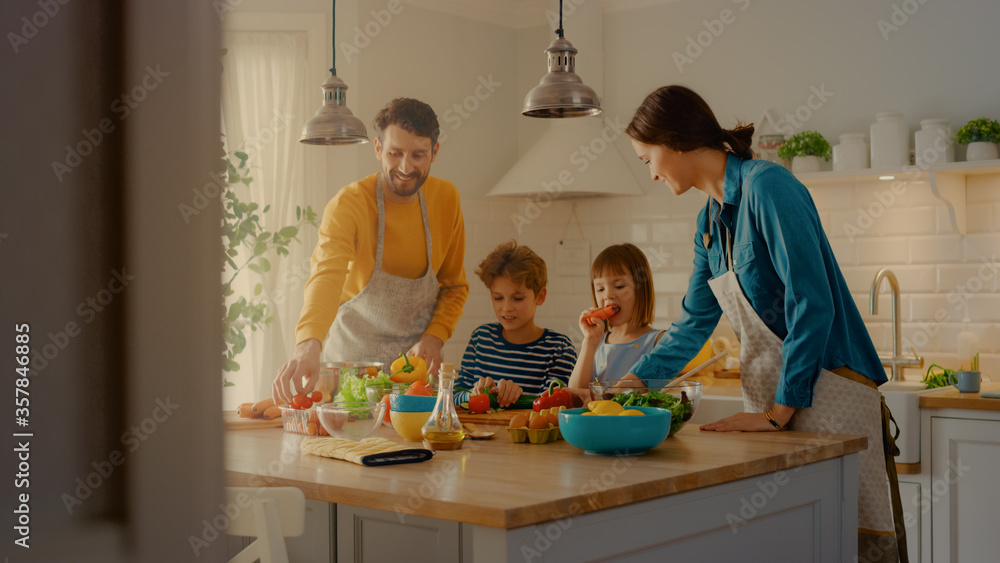 In Kitchen: Family of Four Cooking Together Healthy Dinner. Mother, Father, Little Boy and Girl, Pre