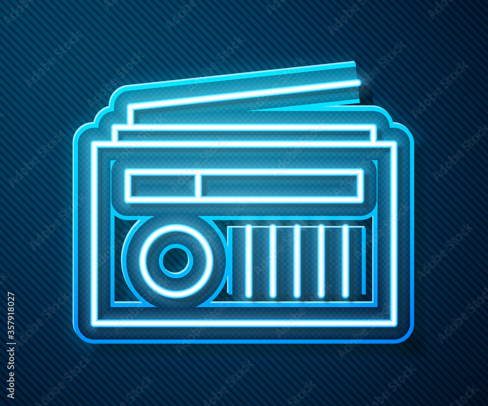 Glowing neon line Radio with antenna icon isolated on blue background. Vector Illustration.