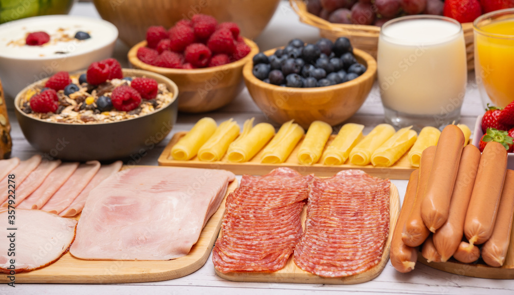 Breakfast in the morning on the table with vegetable,Croissant bread,  Bacon, ham, cheese, lettuce, 