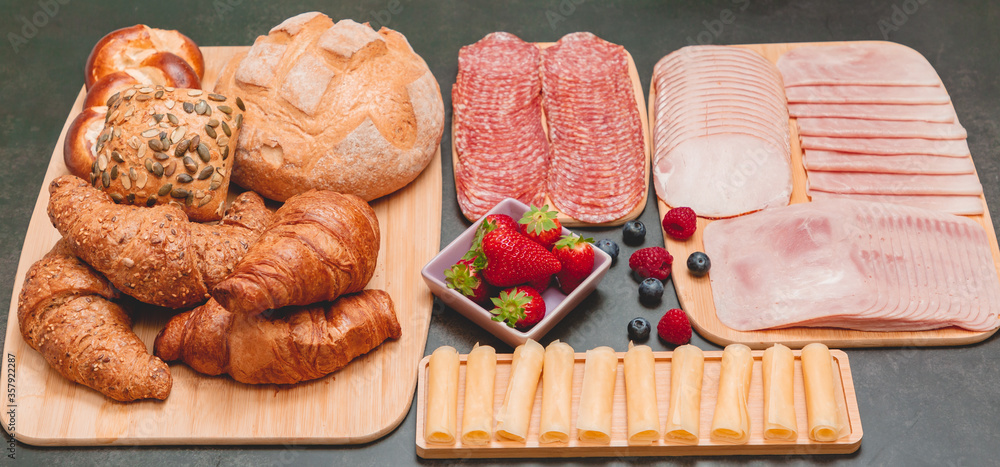 Breakfast served in the morning on the table with Croissant bread, Croissant cereal, Bacon, ham, che