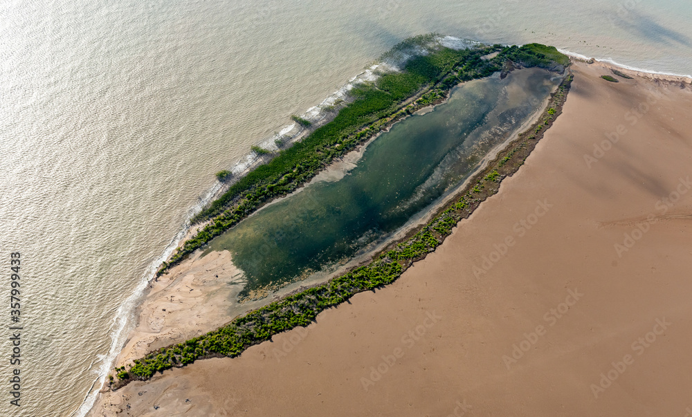 Small lagune surrounded by mangrove and mudflats near Balaklava Island, Port Alma, Queensland