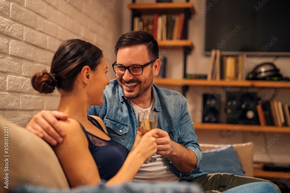 Loving couple relaxing at home, portrait.