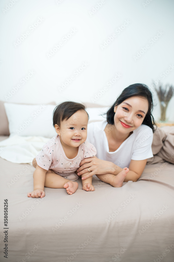 Cute little girl sitting in a room. Child have fun at home.