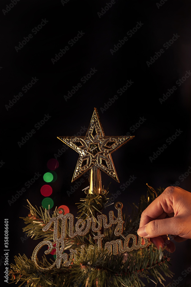 Christmas background concept- beautiful decor bauble hanging on the Christmas tree with sparkling li