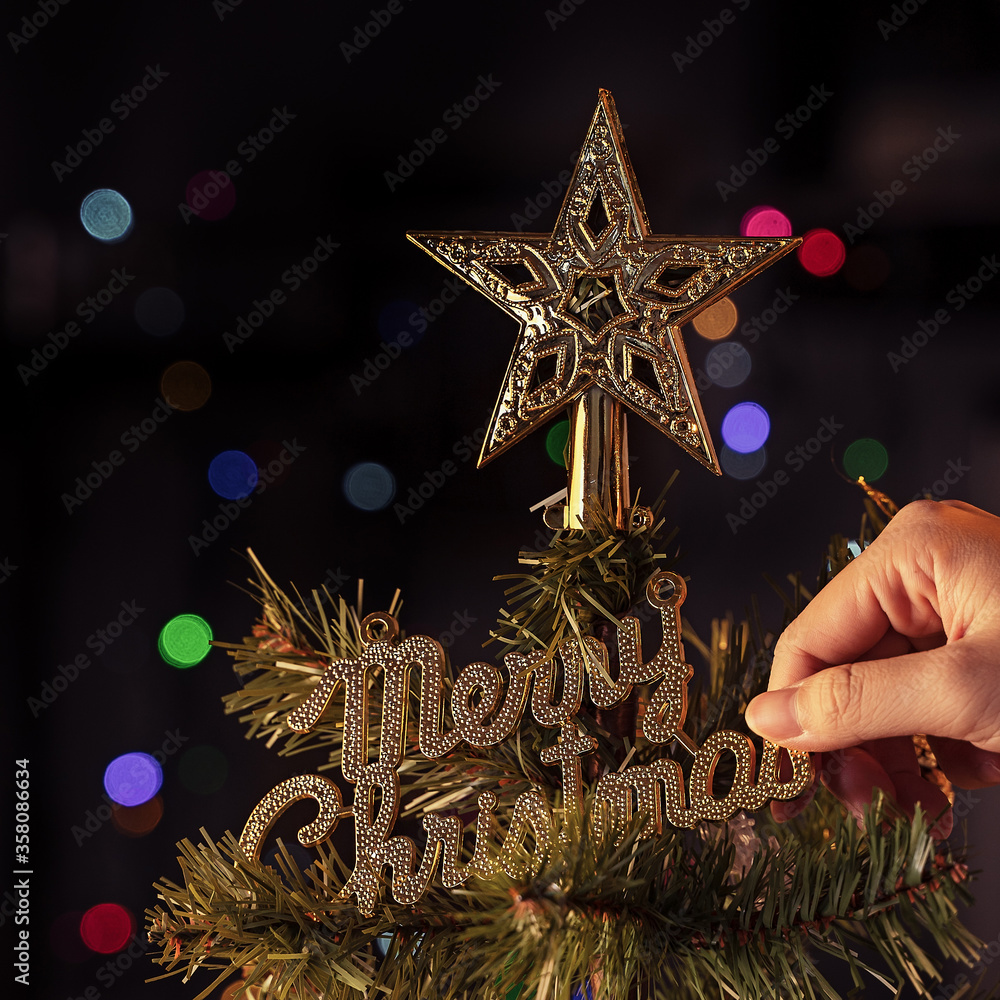 Christmas background concept- beautiful decor bauble hanging on the Christmas tree with sparkling li