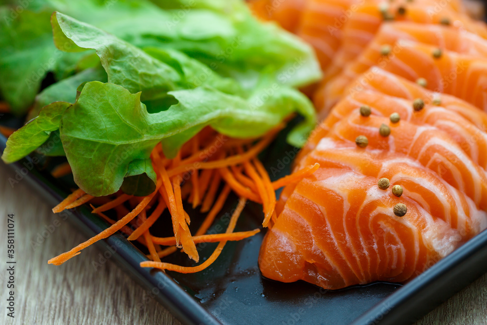 Raw salmon slice or salmon sashimi in Japanese style