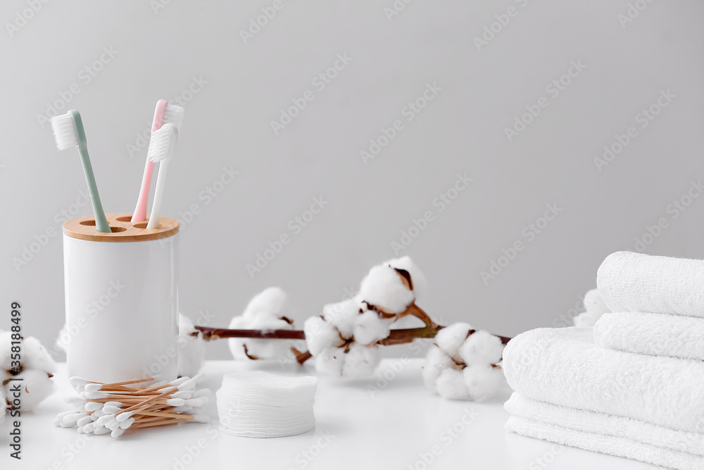 Cotton flowers with supplies on table