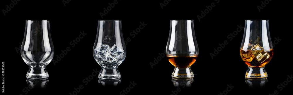 Set of four glasses for alcoholic drinks on black background