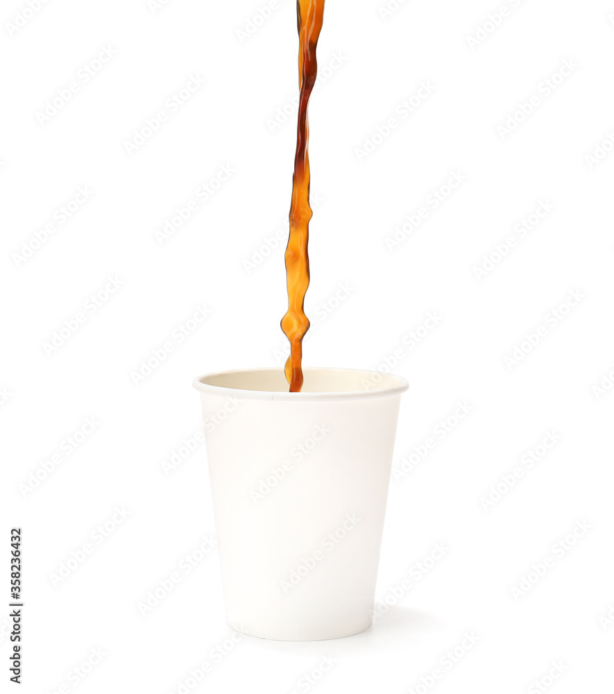 Pouring of hot coffee in cup on white background