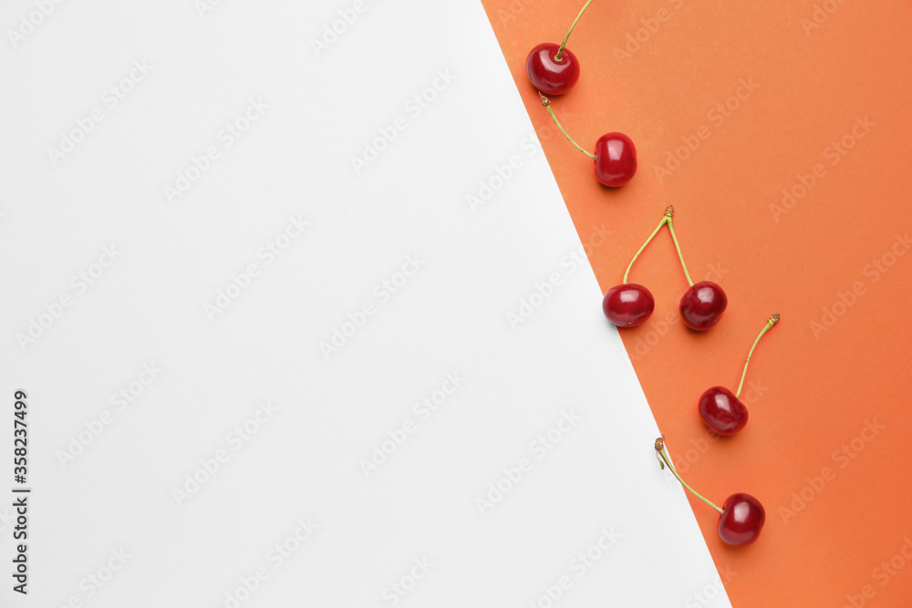 Ripe sweet cherry on color background