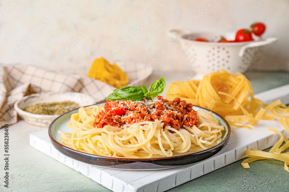 Plate with tasty pasta bolognese on table