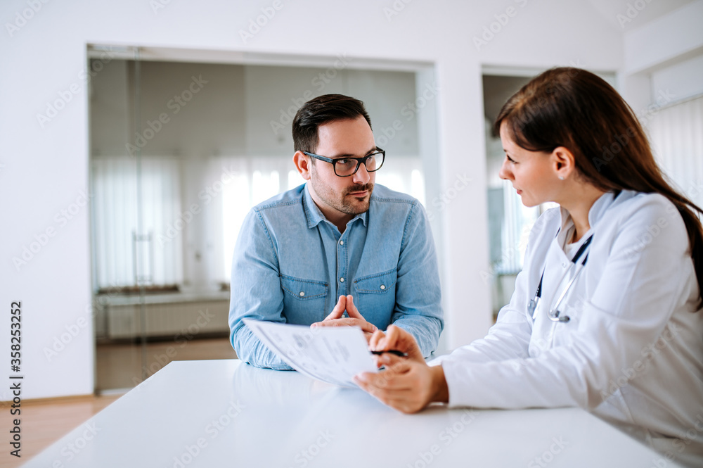 Doctor and patient at doctor office.