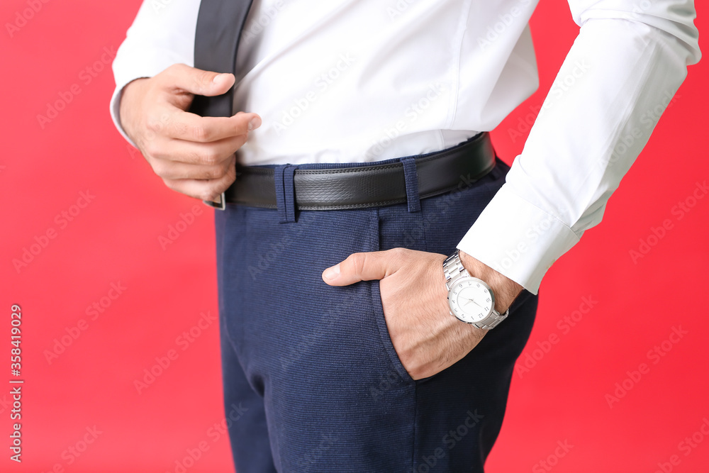 Young man in formal clothes on color background, closeup