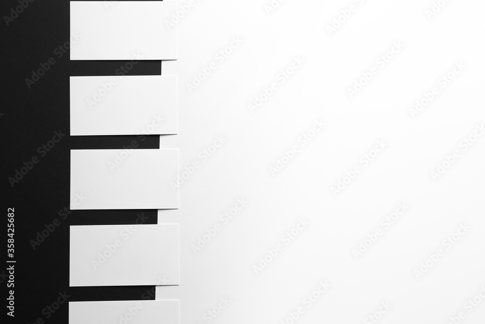 Blank business cards on black and white background