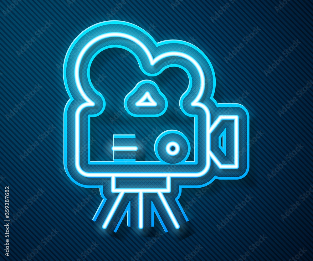 Glowing neon line Retro cinema camera icon isolated on blue background. Video camera. Movie sign. Fi