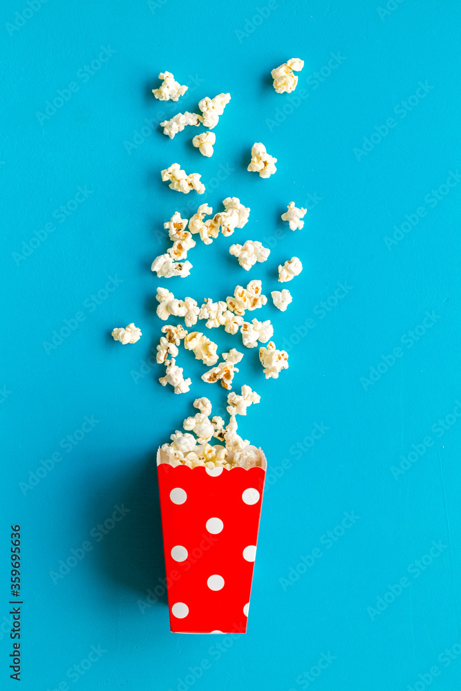 Popcorn in red dotted paper cup top-down