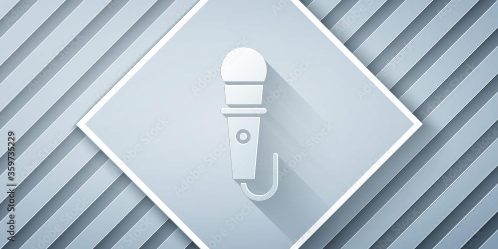 Paper cut Microphone icon isolated on grey background. On air radio mic microphone. Speaker sign. Pa