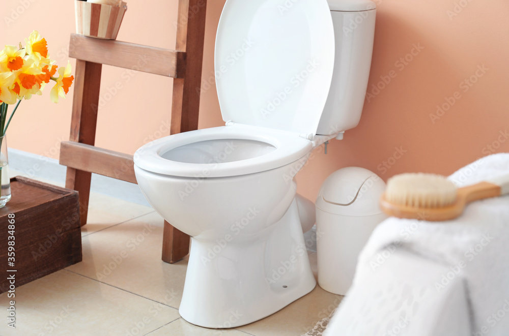 Modern toilet bowl in interior of bathroom