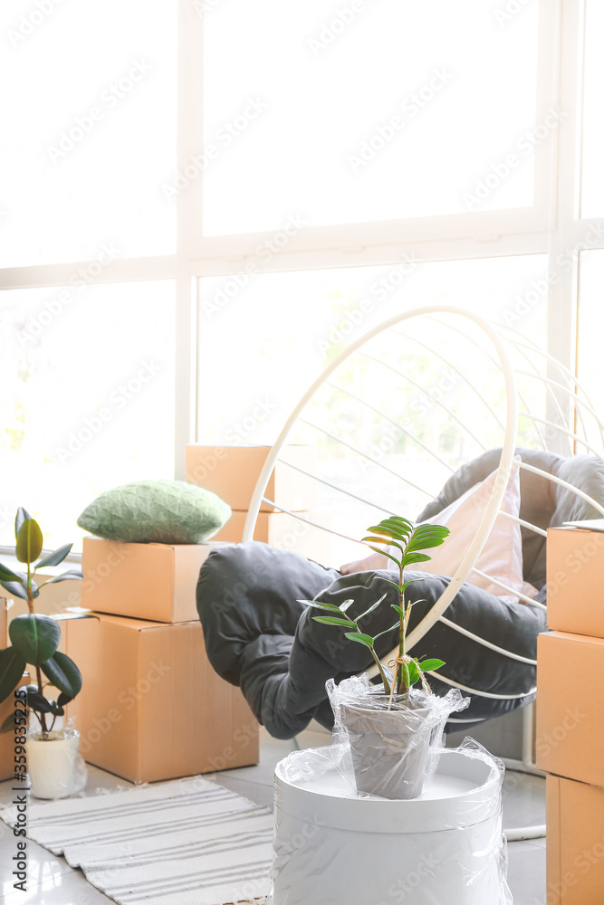 Packed belongings in new flat on moving day