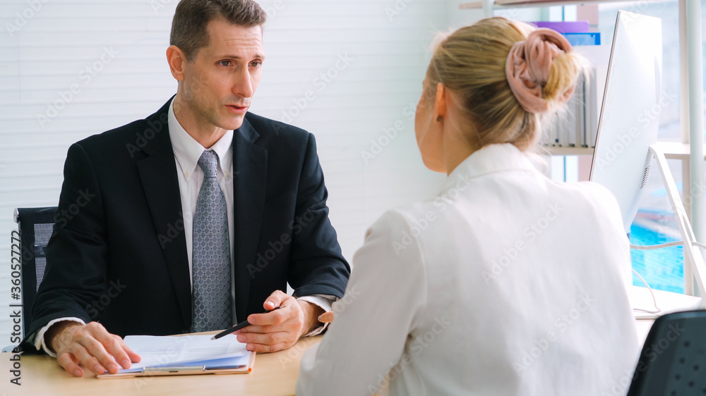 Job seeker in job interview meeting with manager and interviewer at corporate office. The young inte