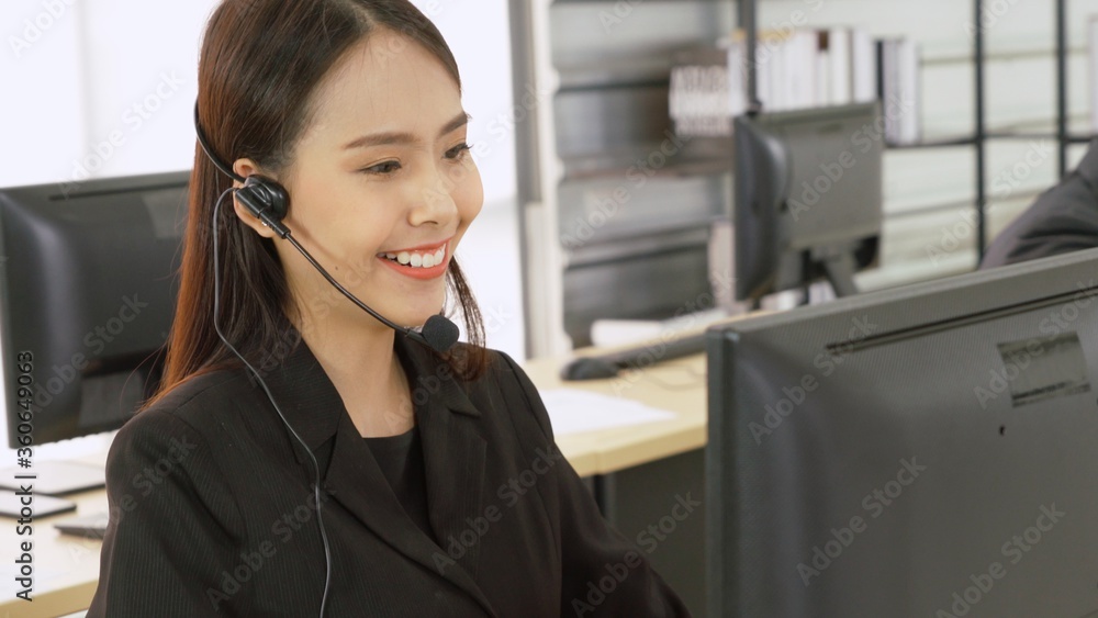 Business people wearing headset working in office to support remote customer or colleague. Call cent