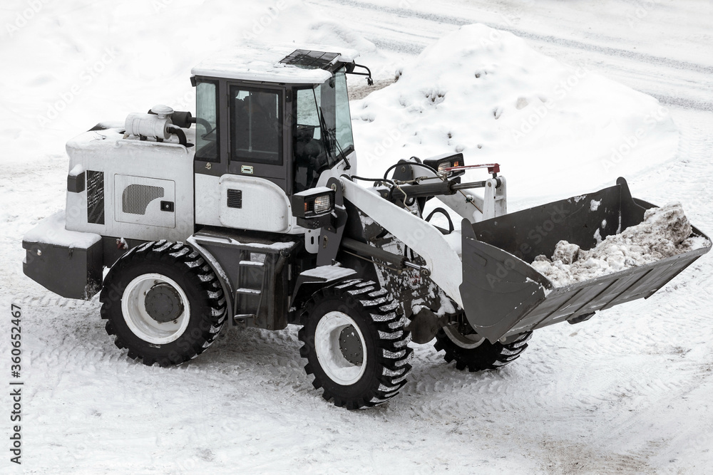 

snow removal using snow-removing equipment - a tractor. view from above