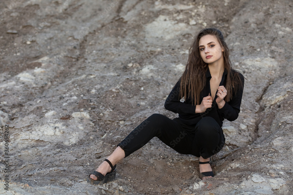 beautiful girl posing among rock formations of a rock. outdoors