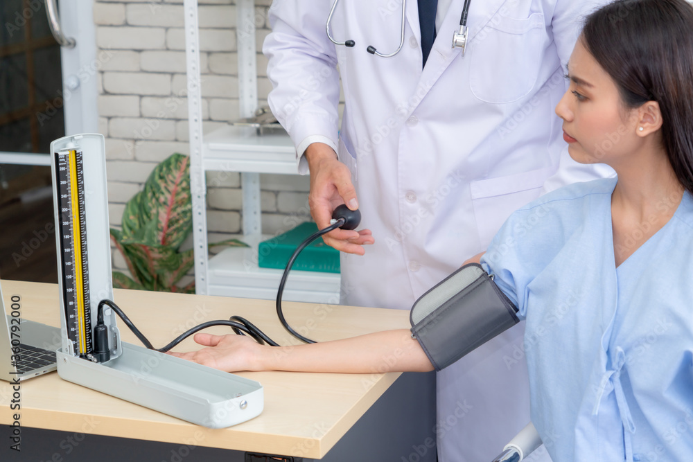 Doctor in professional uniform examining patient at hospital or medical clinic. Health care , medica