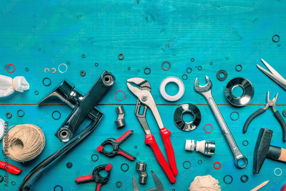 Plumbing toolkit on work desk top view flat lay