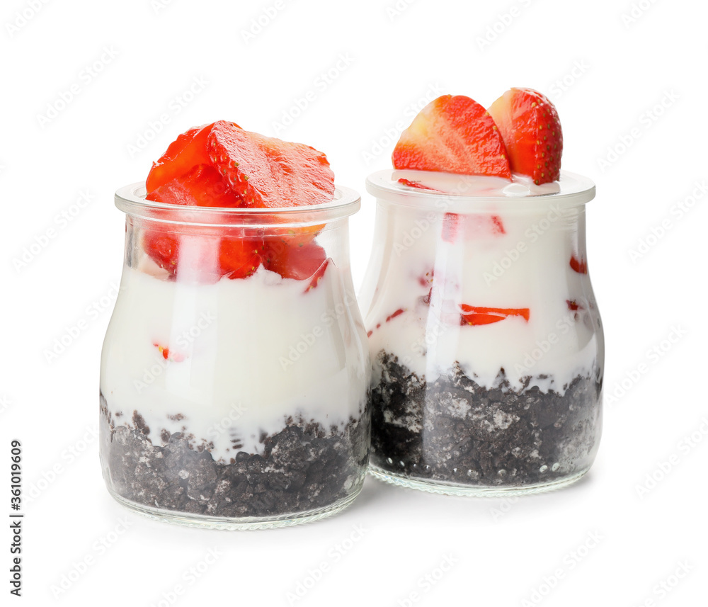 Tasty strawberry dessert in jars on white background