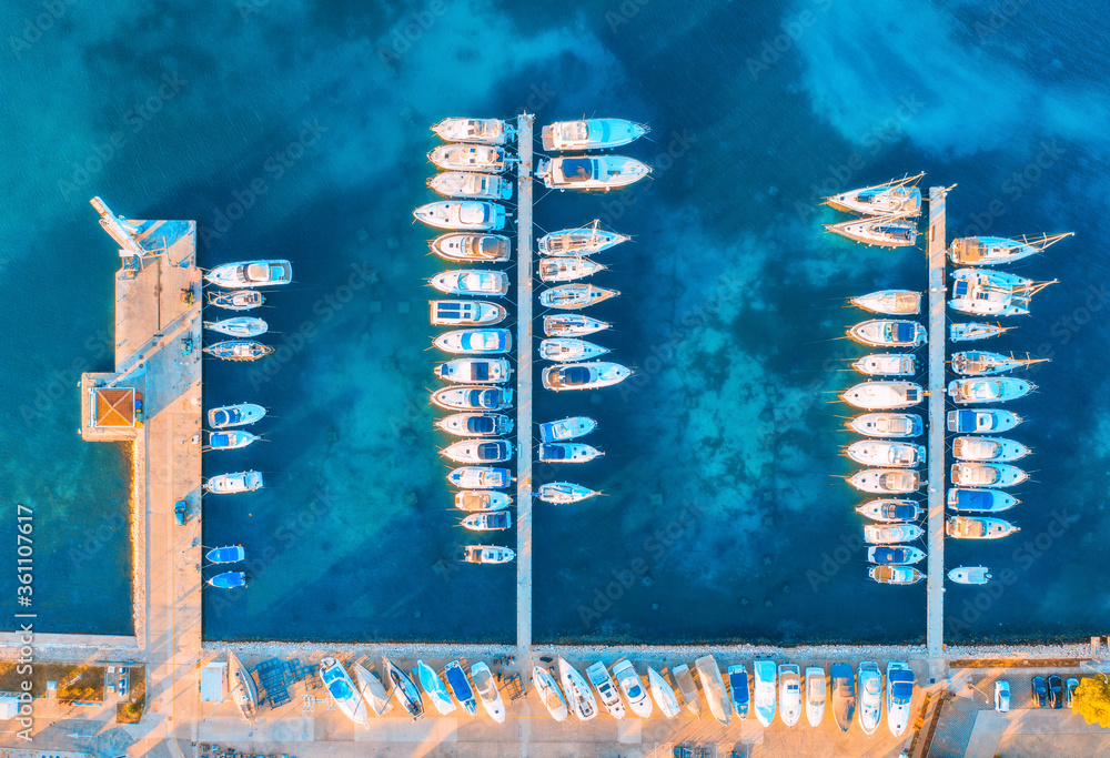 Aerial view of boats and yachts in port in beautiful old city at sunset in Croatia in summer. Landsc