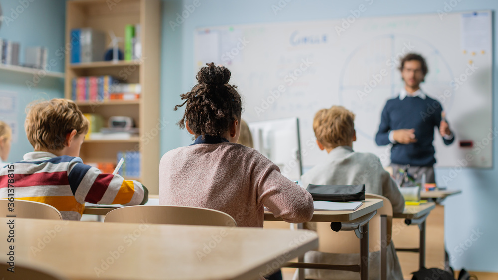 Enthusiastic Teacher Explains Lessons and Asks Questions from a Classroom Full of Bright Diverse Chi