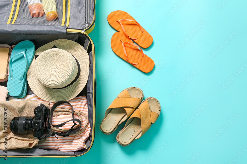 Packed luggage on color background. Travel concept